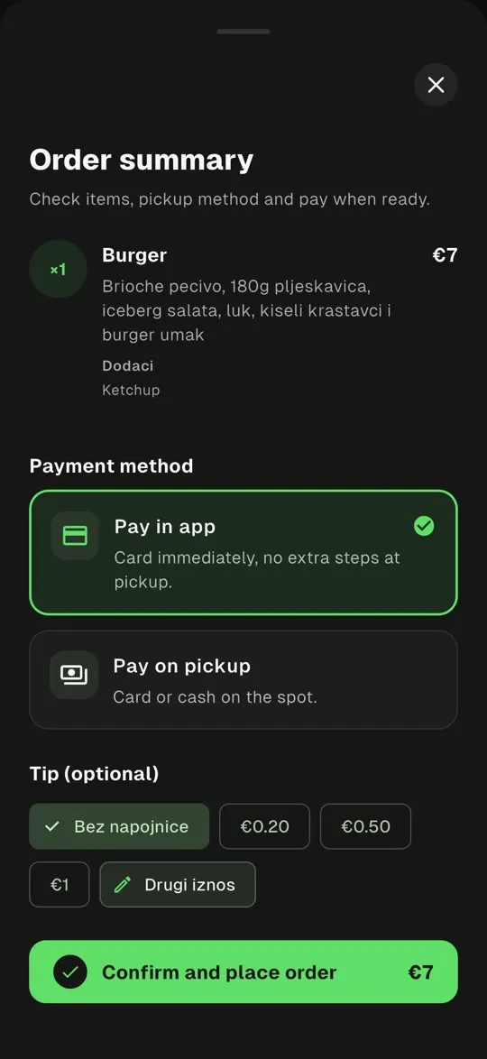 The app's order summary: one burger, a choice between paying in the app by card or paying on pickup by card or cash, an optional tip, and a button to confirm and place the order.
